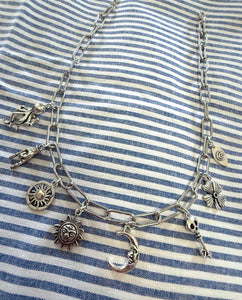 D108 - Single Strand Silver Charm Necklace
