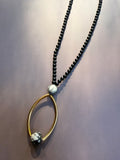 The Gilded Orbit Necklace