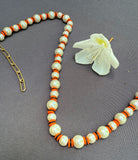 D143- Orange Striped Pearl Necklace