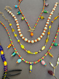 D143- Orange Striped Pearl Necklace